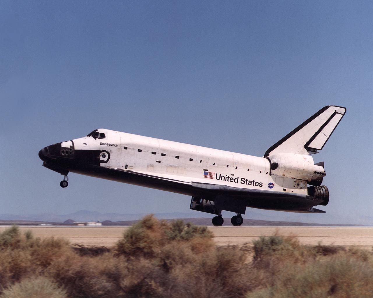 Space Shuttle Endeavour touches down on the runway at Edwards Air Force Base, California to conclude International Space Station construction and supply mission STS-111.