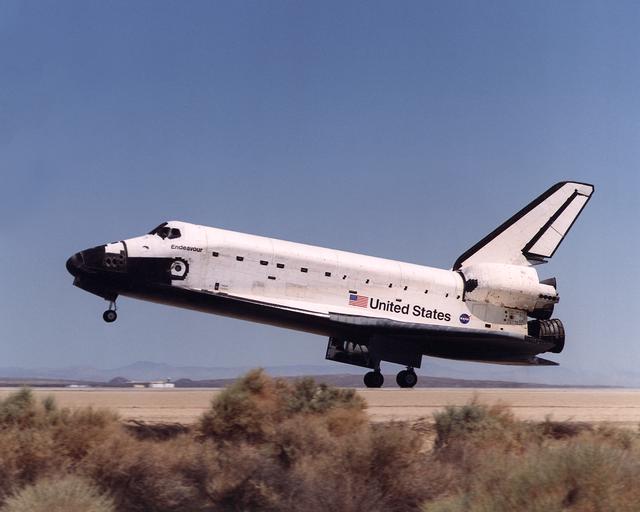 Space Shuttle Endeavour touches down on the runway at Edwards Air Force Base, California to conclude International Space Station construction and supply mission STS-111