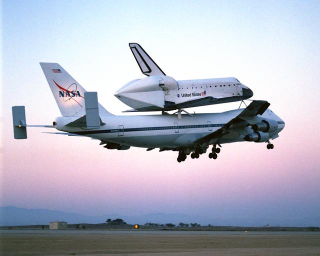 NASA image: The Space Shuttle Endeavour, mounted securely atop one of NASA's modified Boeing 747 Shuttle Carrier Aircraft, left NASA's Dryden Flight Research Center at Edwards Air Force Base in Southern California at sunrise on Friday, June 28, nine days after conclu