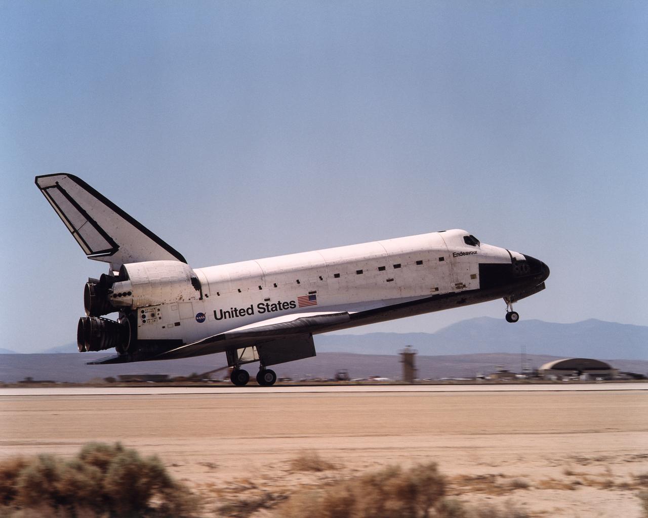 Space Shuttle Endeavour touches down on the runway at Edwards Air Force Base, California to conclude International Space Station construction and supply mission STS-111.
