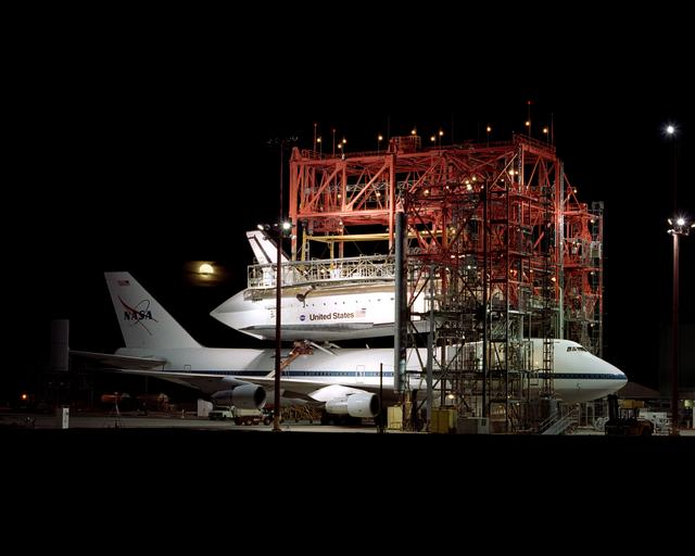 NASA image: The Space Shuttle Endeavour receives post-flight servicing in the Mate-Demate Device (MDD), following its landing at NASA's Dryden Flight Research Center, Edwards, California, June 19, 2002