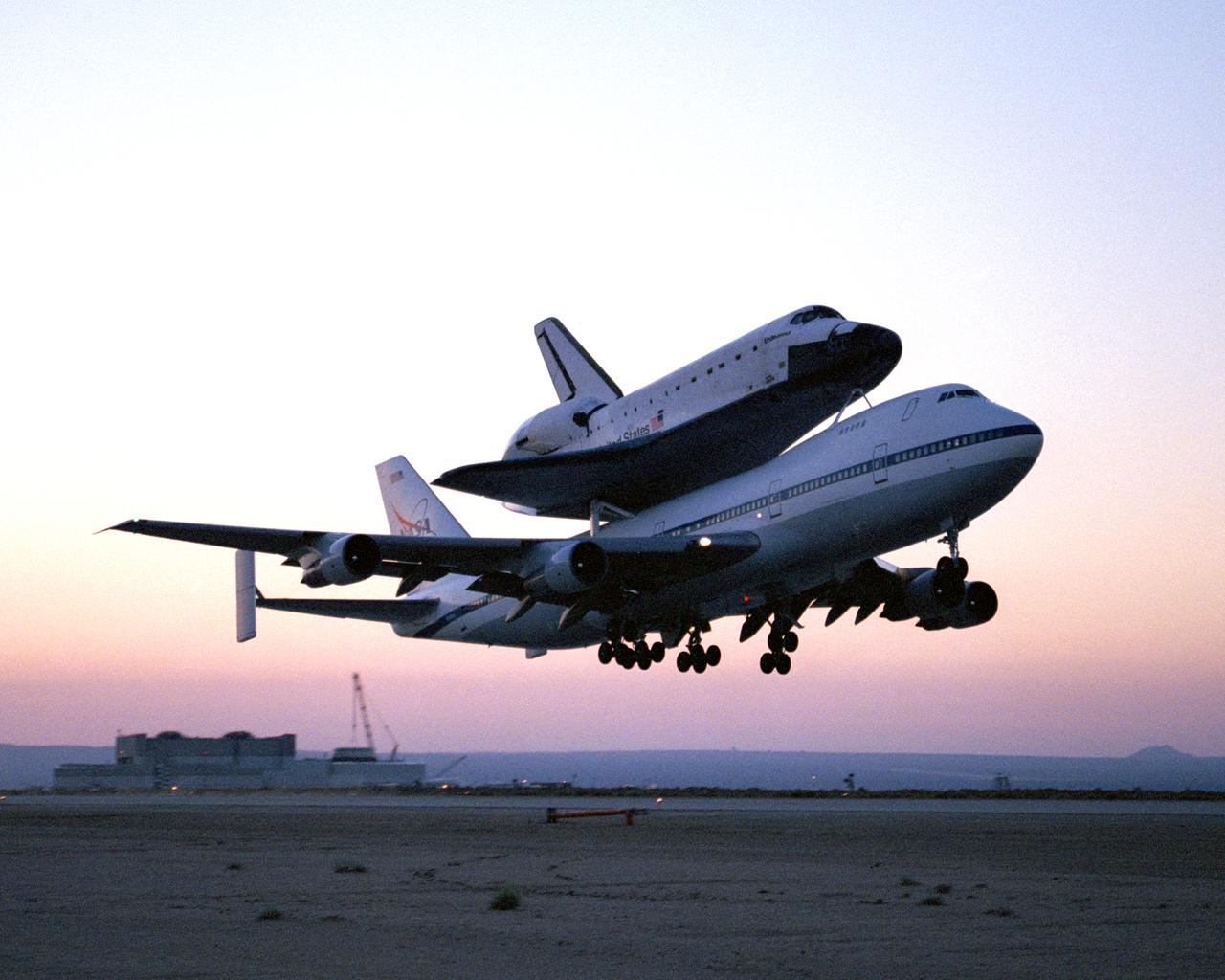 The Space Shuttle Endeavour, mounted securely atop one of NASA's modified Boeing 747 Shuttle Carrier Aircraft, left NASA's Dryden Flight Research Center at Edwards Air Force Base in Southern California at sunrise on Friday, June 28.