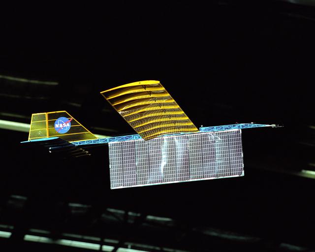 An experimental radio-controlled model aircraft is seen here in flight, powered only by light energy beamed to it by a spotlight.