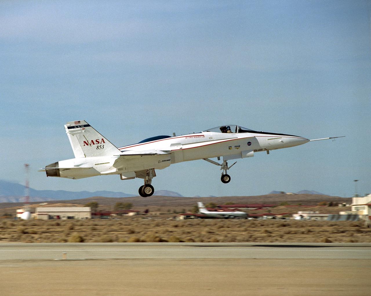 The Active Aeroelastic Wing F-18A lifts off on its first checkout flight November 15, 2002, from NASA's Dryden Flight Research Center at Edwards Air Force Base, Calif. The checkout flight initiated a two-phase NASA--Air Force flight research program that will investigate the potential of aerodynamically twisting flexible wings to improve maneuverability of high-performance aircraft at transonic and supersonic speeds.
