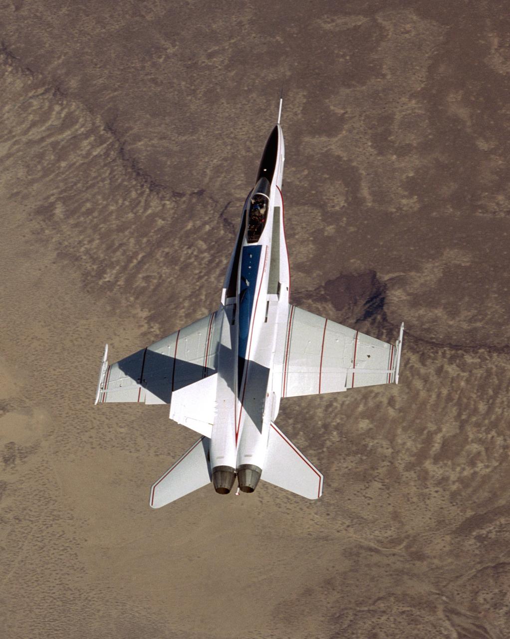 The modified F/A-18 being flown in the joint NASA/Air Force Active Aeroelastic Wing research program shows off its colors during its first checkout flight from NASA's Dryden Flight Research Center.