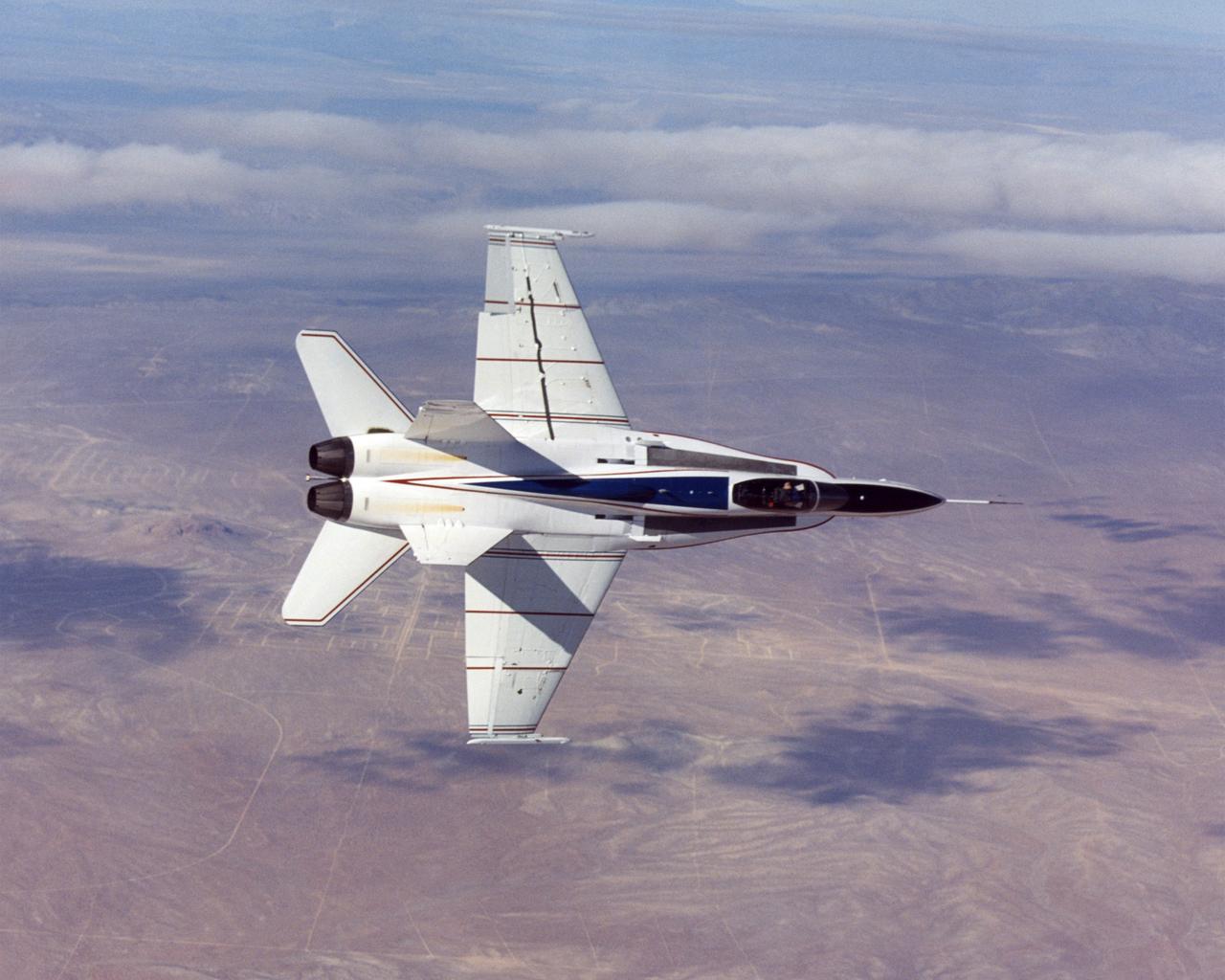 NASA Dryden's highly-modified Active Aeroelastic Wing F/A-18A shows off its form during a 360-degree aileron roll during a research flight.