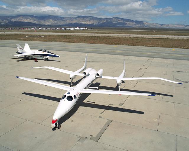NASA image: Scaled Composites' Proteus aircraft and an F/A-18 Hornet from NASA's Dryden Flight Research Center at Mojave Airport in Southern California.