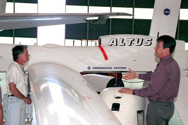 NASA image: Dryden's David Bushman explains the capabilities of the Altus UAV to NASA Langley's Charles Hudgins
