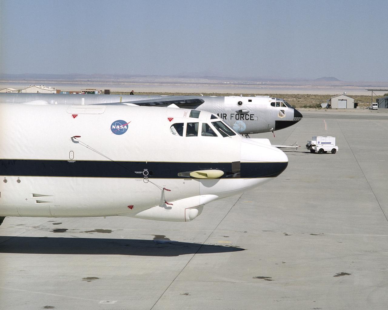 NASA's new B-52H mother ship at the ready, with renowned NASA B-52B 008 poised beside.
