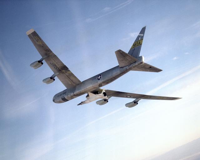 NASA image: NASA's B-52 mother ship carries the X-43A and its booster rocket on a captive carry flight Jan. 26, 2004