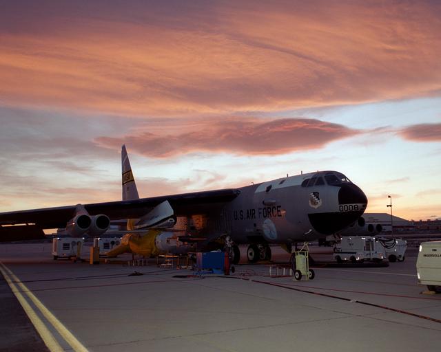 NASA image: NASA's B-52B launch aircraft at sunset with the second X-43A hypersonic research vehicle attached to a modified Pegasus rocket under its right wing