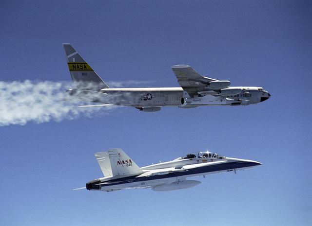 NASA image: NASA's B-52B launch aircraft cruises to a test range over the Pacific Ocean carrying the second X-43A vehicle attached to a Pegasus rocket on March 27, 2004