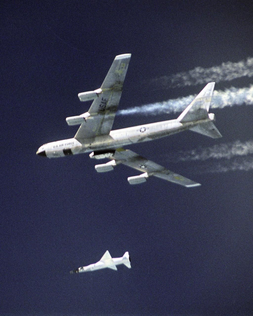 The second X-43A hypersonic research aircraft and its modified Pegasus booster rocket drop away from NASA's B-52B launch aircraft over the Pacific Ocean on March 27, 2004. The mission originated from the NASA Dryden Flight Research Center at Edwards Air Force Base, Calif. Moments later the Pegasus booster ignited to accelerate the X-43A to its intended speed of Mach 7.