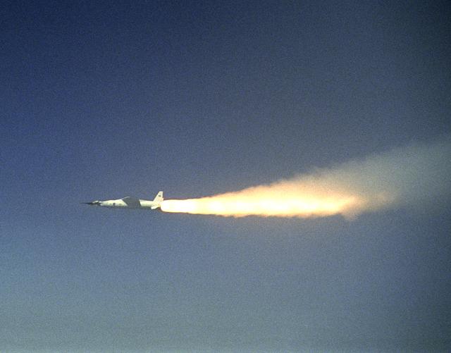 NASA image: A modified Pegasus rocket ignites moments after release from the B-52B, beginning the acceleration of the X-43A over the Pacific Ocean on March 27, 2004