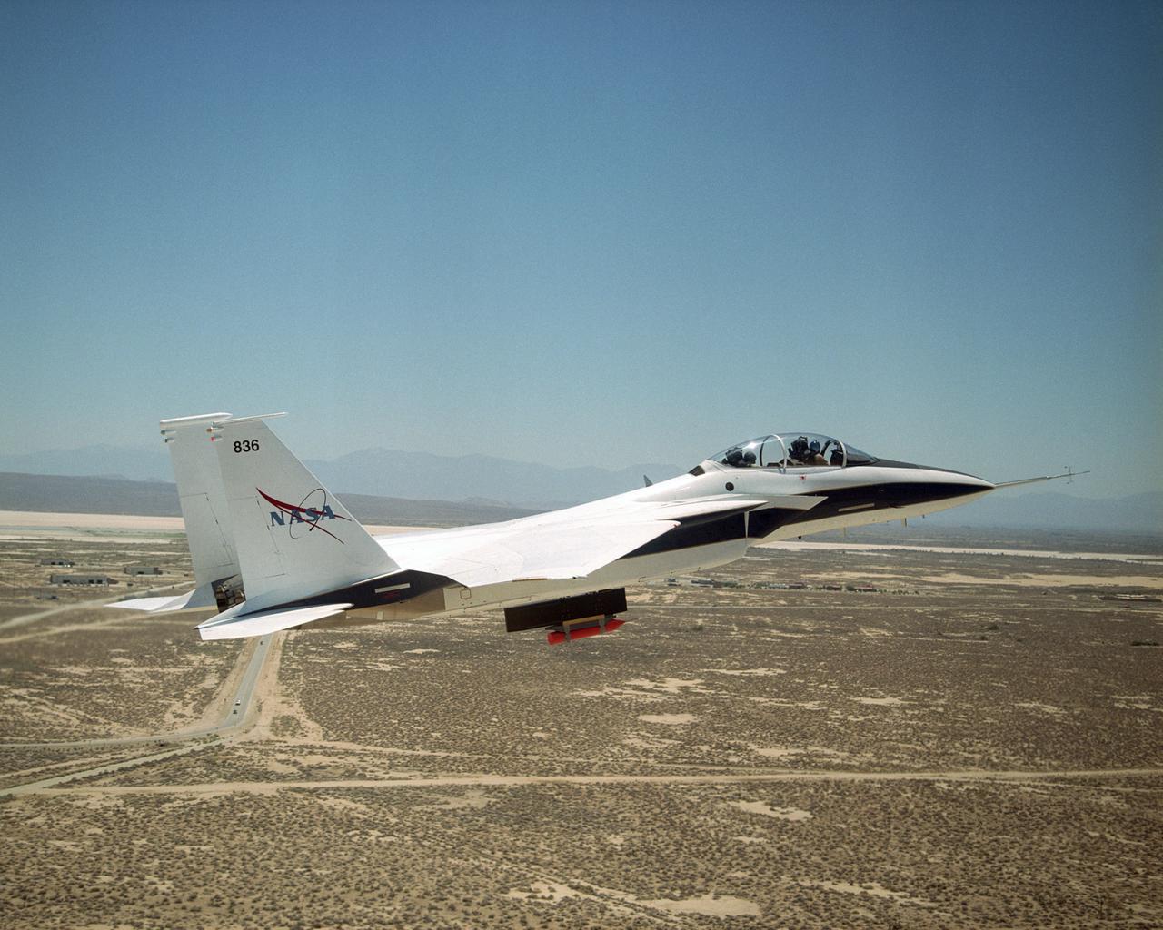 NASA's F-15B Research Testbed aircraft flew instrumentation in June 2004 called the Local Mach Investigation (LMI), designed to gather local airflow data for future research projects using the aircraft's Propulsion Flight Test Fixture (PFTF). The PFTF is the black rectangular fixture attached to the aircraft's belly. The LMI package was located in the orange device attached to the PFTF.