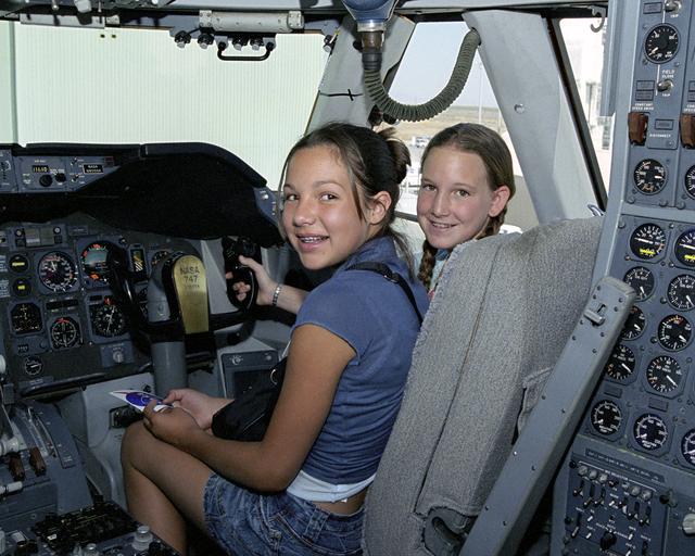 NASA image: Leah Robson and Bridgette Puljiz in the flight deck of NASA's 747 shuttle carrier during Take Your Children to Work Day