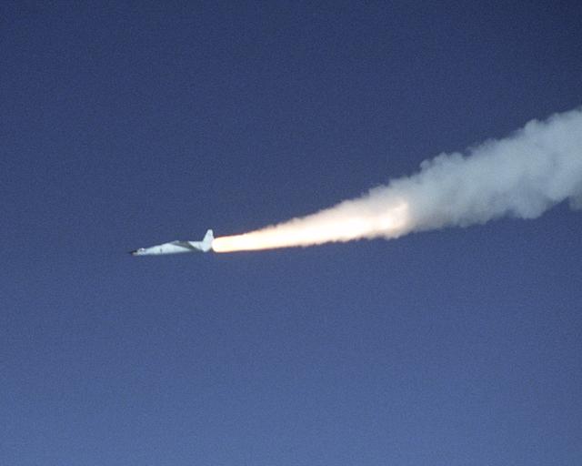 NASA image: A modified Pegasus rocket ignites moments after release from the B-52B, beginning the acceleration of the X-43A over the Pacific Ocean on Nov. 16, 2004