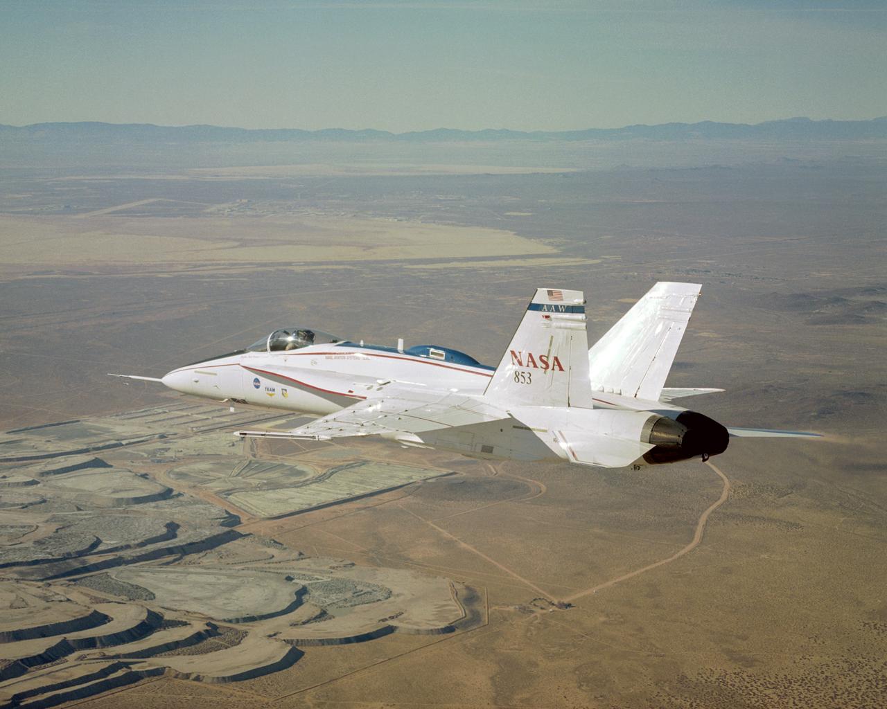 NASA's modified Active Aeroelastic Wing F/A-18 skims over portions of the U.S. Borax mine during a recent mission from the Dryden Flight Research Center.