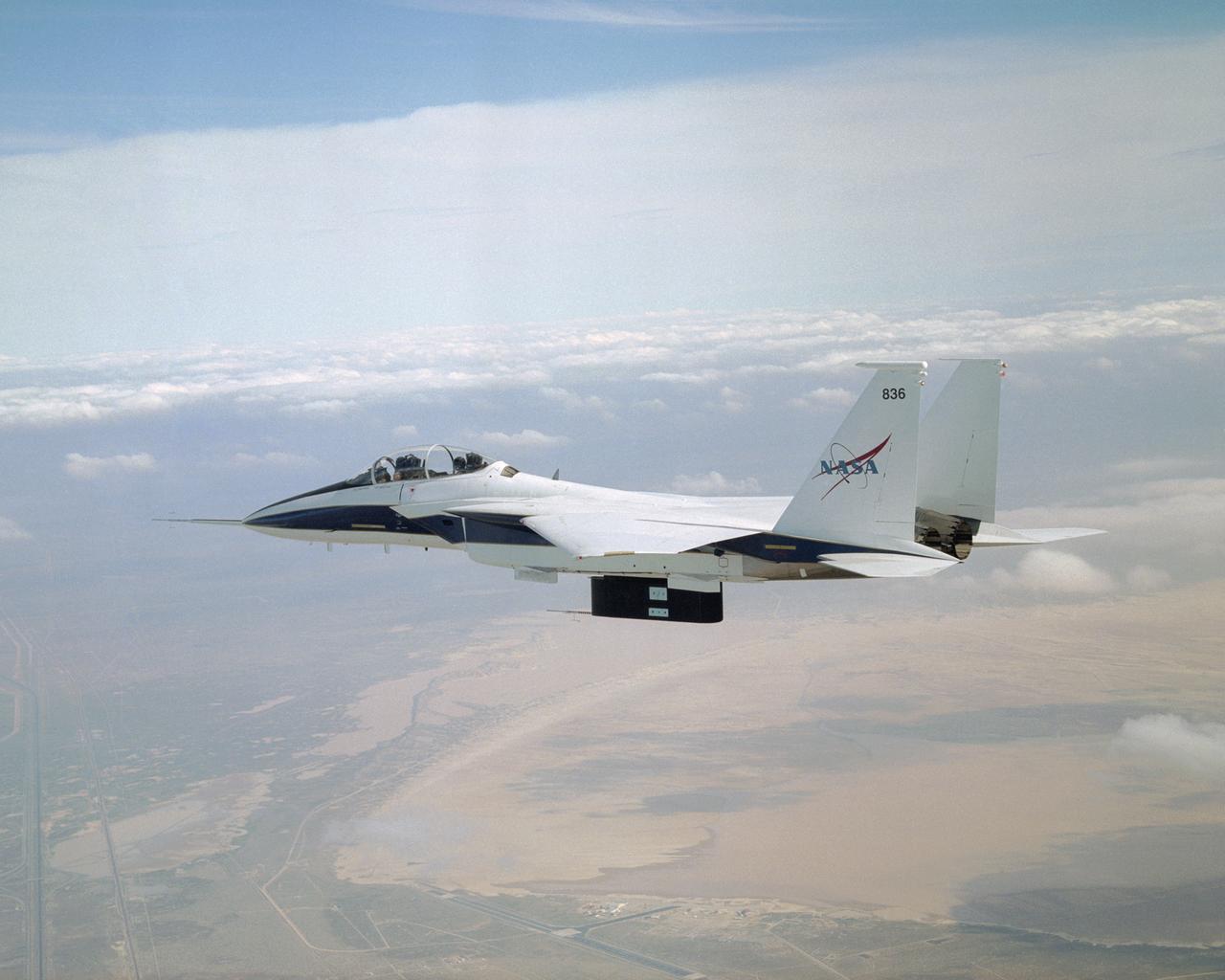 All six divots of thermal insulation foam have been ejected from the flight test fixture on NASA's F-15B testbed as it returns from a LIFT experiment flight.