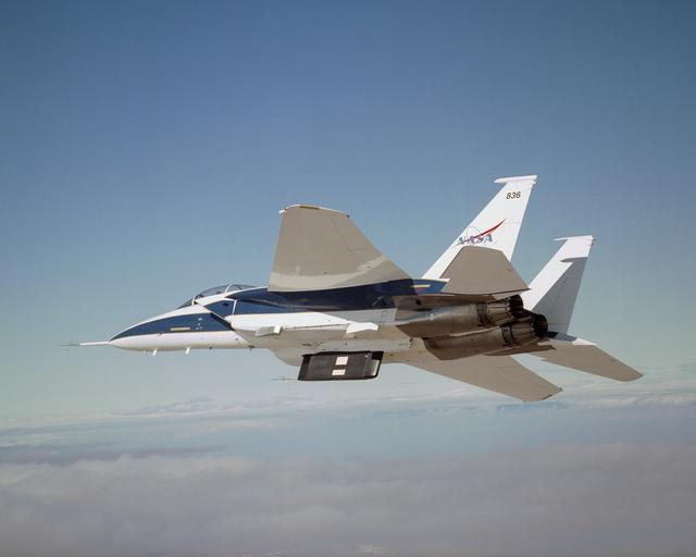 NASA image: Two panels of Space Shuttle TPS insulation were mounted on the flight test fixture underneath NASA's F-15B during the Lifting Foam Trajectory flight test series