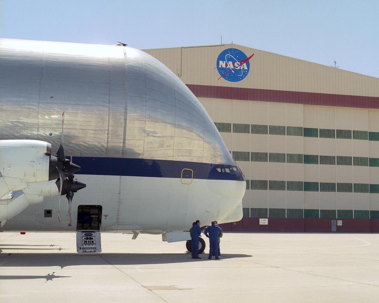 NASA's outsize Super Guppy cargo plane dwarfs its flight crew after its arrival at NASA Dryden Flight Research Center for a landing gear change.