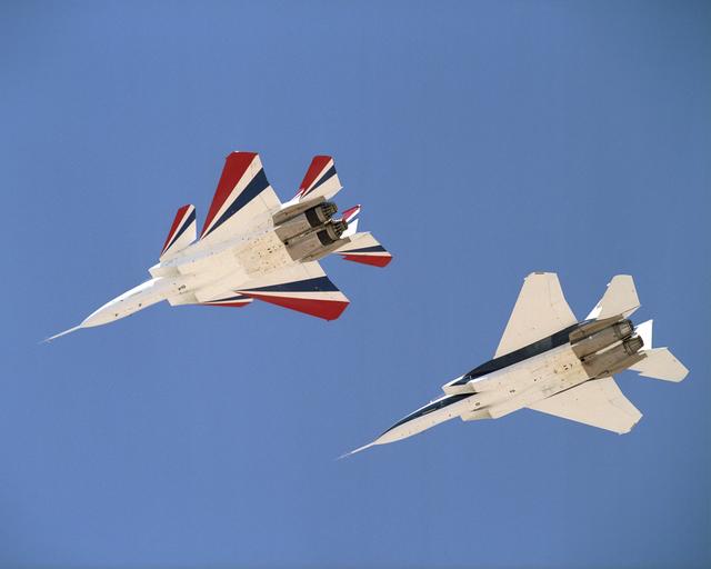 NASA image: NASA's two modified F-15B research aircraft joined up for a fly-over of NASA's Dryden Flight Research Center on Edwards AFB, Calif., after a research mission.