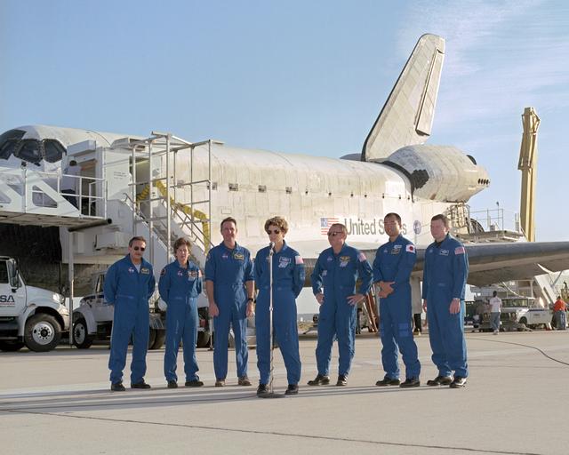 The crew of Space Shuttle mission STS-114 gathered for a press brief following landing at Edwards Air Force Base, California, 5:11 am, August 9, 2005