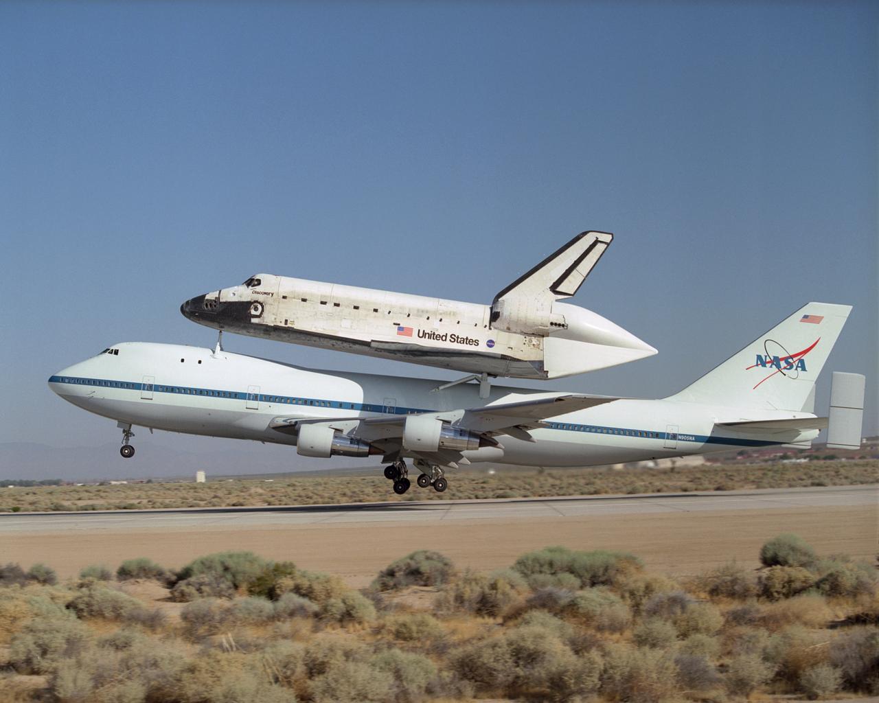 NASA's modified Boeing 747 Shuttle Carrier Aircraft with the Space Shuttle Discovery on top lifts off from Edwards Air Force Base to begin its ferry flight back to the Kennedy Space Center in Florida. The cross-country journey will take two days, with stops at several intermediate points for refueling. Space Shuttle Discovery landed safely at NASA's Dryden Flight Research Center at Edwards Air Force Base in California at 5:11:22 a.m. PDT, August 9, 2005, following the very successful 14-day STS-114 return to flight mission.  During their two weeks in space, Commander Eileen Collins and her six crewmates tested out new safety procedures and delivered supplies and equipment the International Space Station.  Discovery spent two weeks in space, where the crew demonstrated new methods to inspect and repair the Shuttle in orbit. The crew also delivered supplies, outfitted and performed maintenance on the International Space Station. A number of these tasks were conducted during three spacewalks.  In an unprecedented event, spacewalkers were called upon to remove protruding gap fillers from the heat shield on Discovery's underbelly. In other spacewalk activities, astronauts installed an external platform onto the Station's Quest Airlock and replaced one of the orbital outpost's Control Moment Gyroscopes.  Inside the Station, the STS-114 crew conducted joint operations with the Expedition 11 crew. They unloaded fresh supplies from the Shuttle and the Raffaello Multi-Purpose Logistics Module. Before Discovery undocked, the crews filled Raffeallo with unneeded items and returned to Shuttle payload bay.  Discovery launched on July 26 and spent almost 14 days on orbit.
