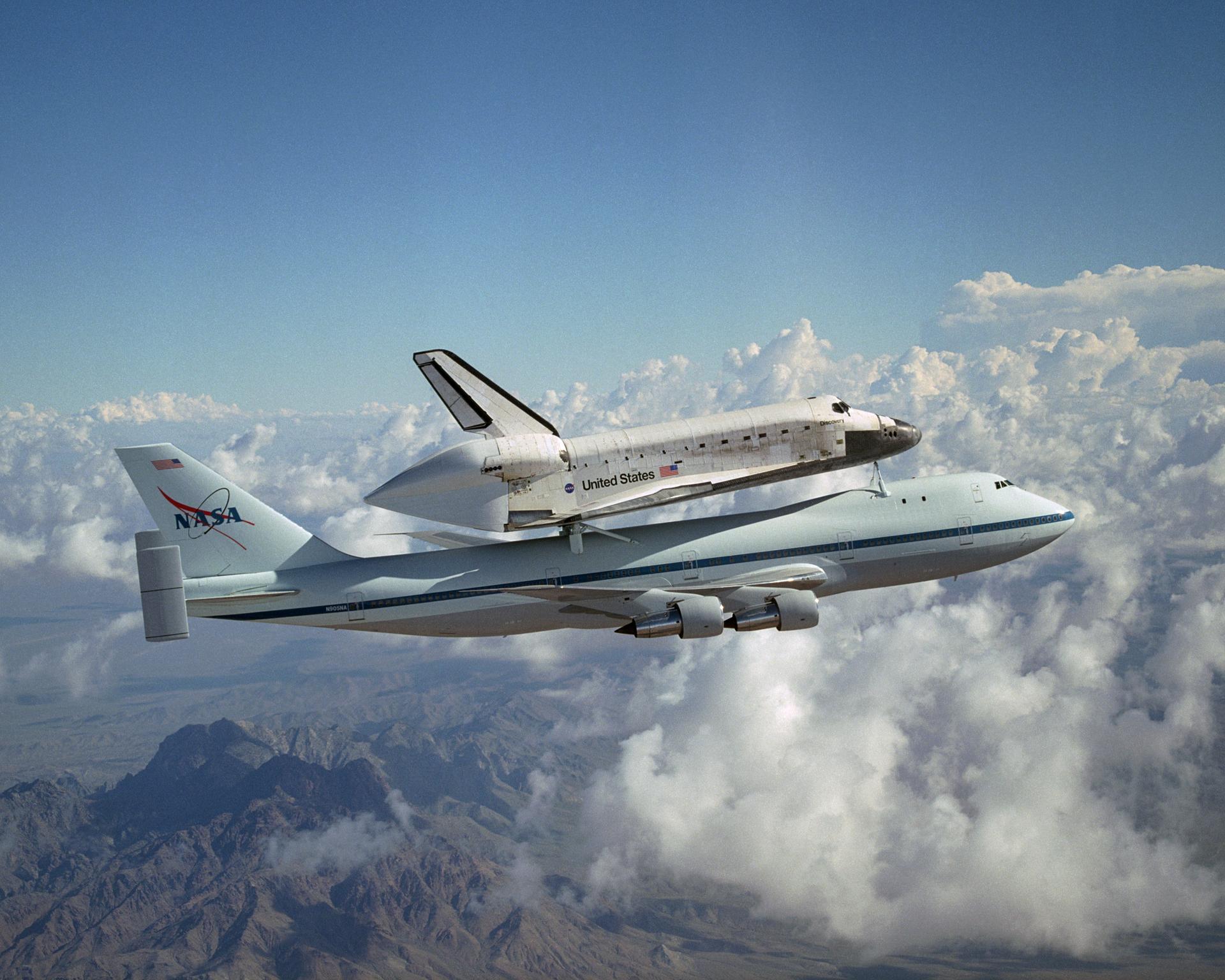 The Space Shuttle Discovery hitched a ride on NASA's modified Boeing 747 Shuttle Carrier Aircraft for the flight from the Dryden Flight Research Center in California, to Kennedy Space Center, Florida,