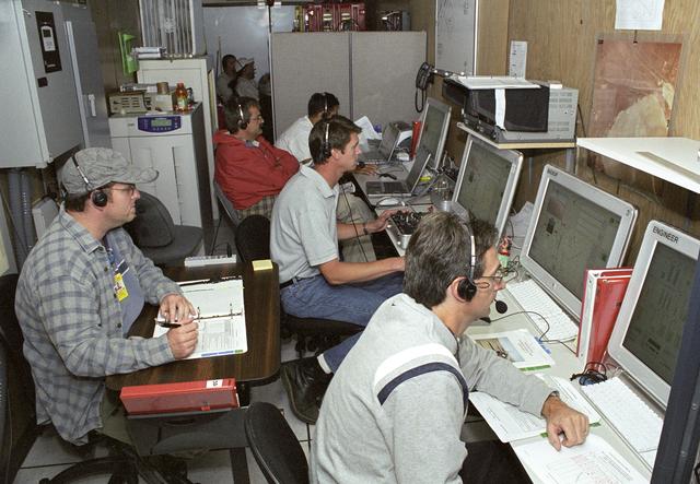 NASA image: AeroVironment engineers and technicians closely monitor flight data in the ground control station during the Pathfinder-Plus' turbulence measurement flights.