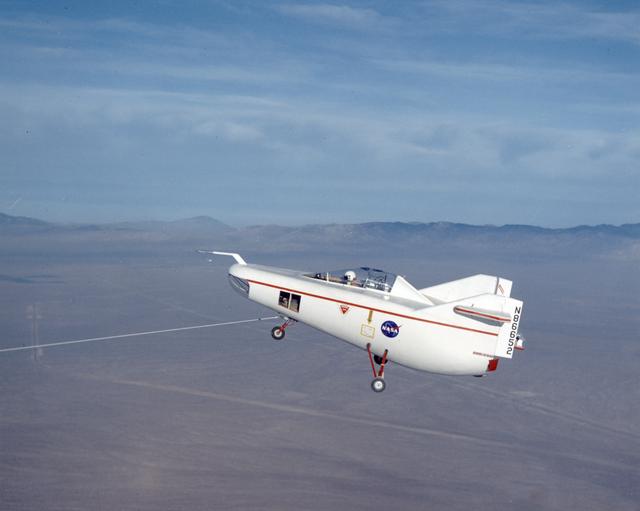 NASA image: M2-F1 in flight over lakebed on tow line