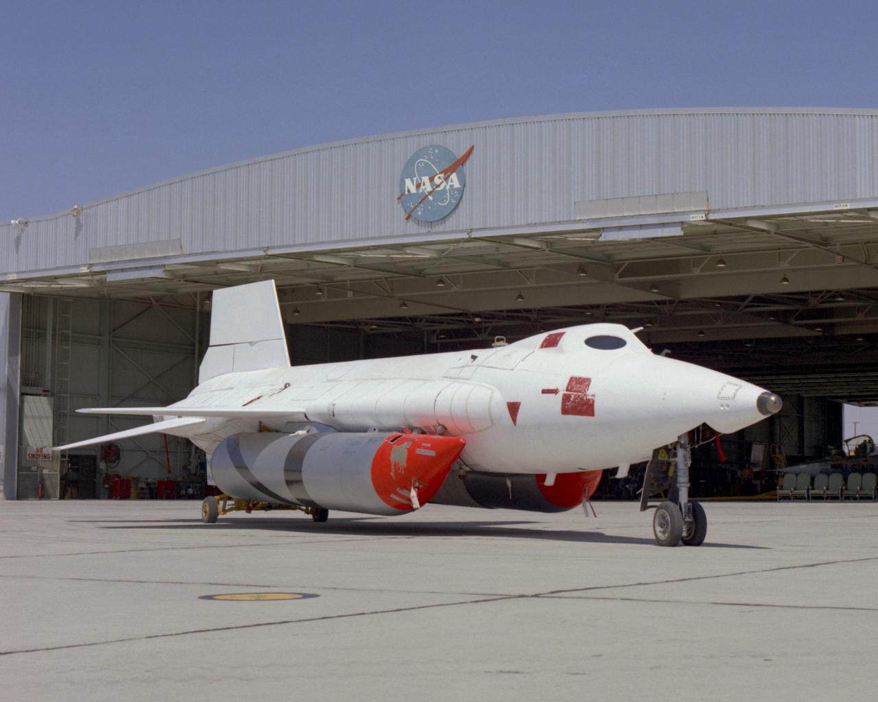 X-15A-2 with full scale ablative and external tanks installed parked in front of hangar. In June 1967, the X-15A-2 rocket-powered research aircraft received a full-scale ablative coating to protect the craft from the high temperatures associated with hypersonic flight (above Mach 5). This pink eraser-like substance, applied to the X-15A-2 aircraft (56-6671), was then covered with a white sealant coat before flight. This coating would help the #2 aircraft reach the record speed of 4,520 mph (Mach 6.7).