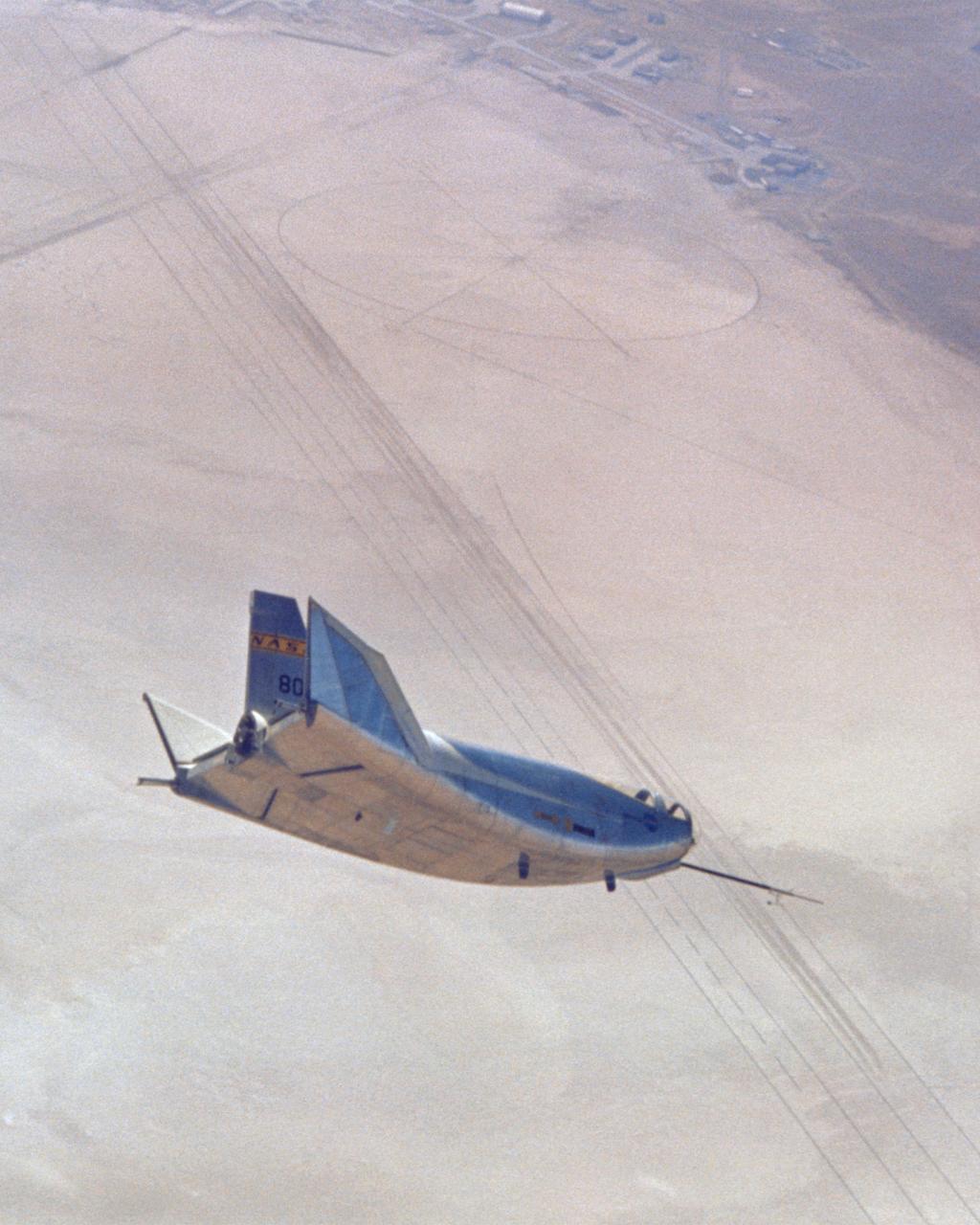 This photo shows the HL-10 in flight, turning to line up with lakebed runway 18. The pilot for this flight, the 29th of the HL-10 series, was Bill Dana. The HL-10 reached a peak altitude of 64,590 feet and a top speed of Mach 1.59 on this particular flight.