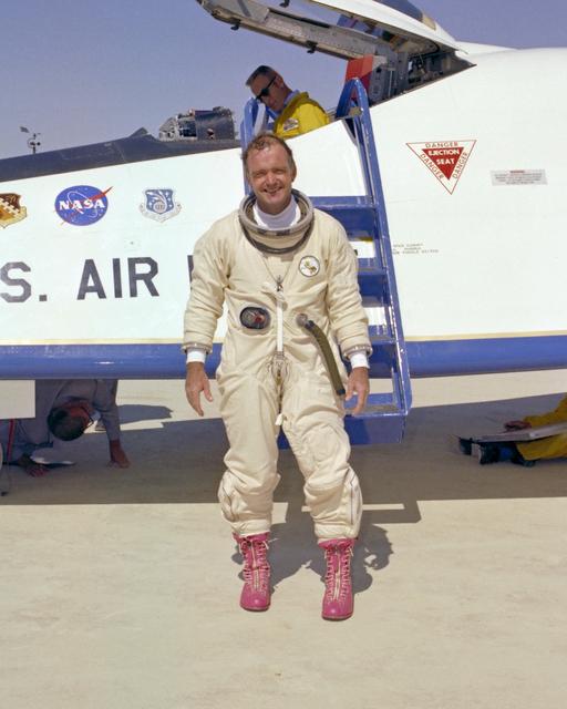 NASA image: NASA test pilot Bill Dana, resplendent in pink boots and pressure suit, was all smiles following the last powered flight of the X-24B on Sept. 23, 1975.