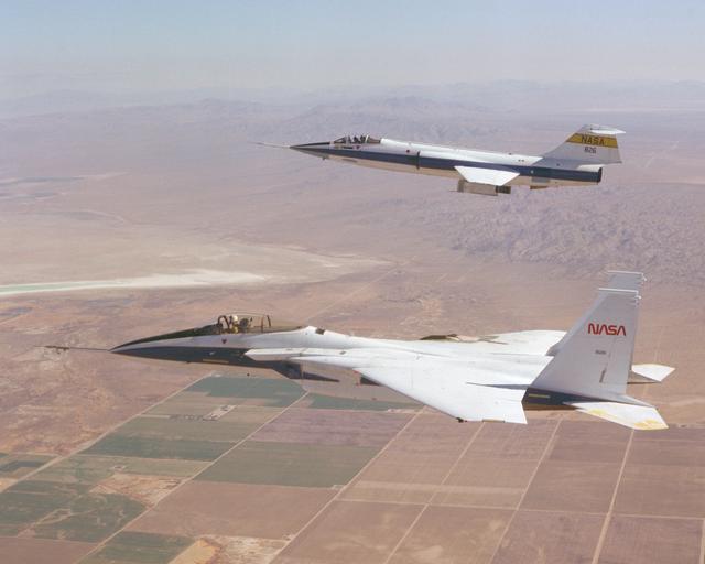 NASA image: F-15 #281 and F-104 #826 fly in formation during Space Shuttle tile testing.
