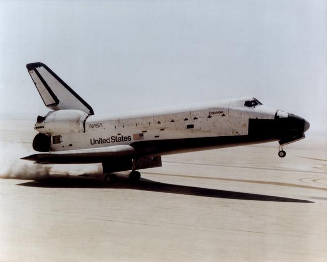 The Space Shuttle Columbia touches down on lakebed runway 23 at Edwards Air Force Base, Calif., to conclude the first orbital shuttle mission
