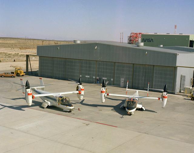 NASA image: XV-15 tilt rotor ship #1 and #2 parked on NASA ramp