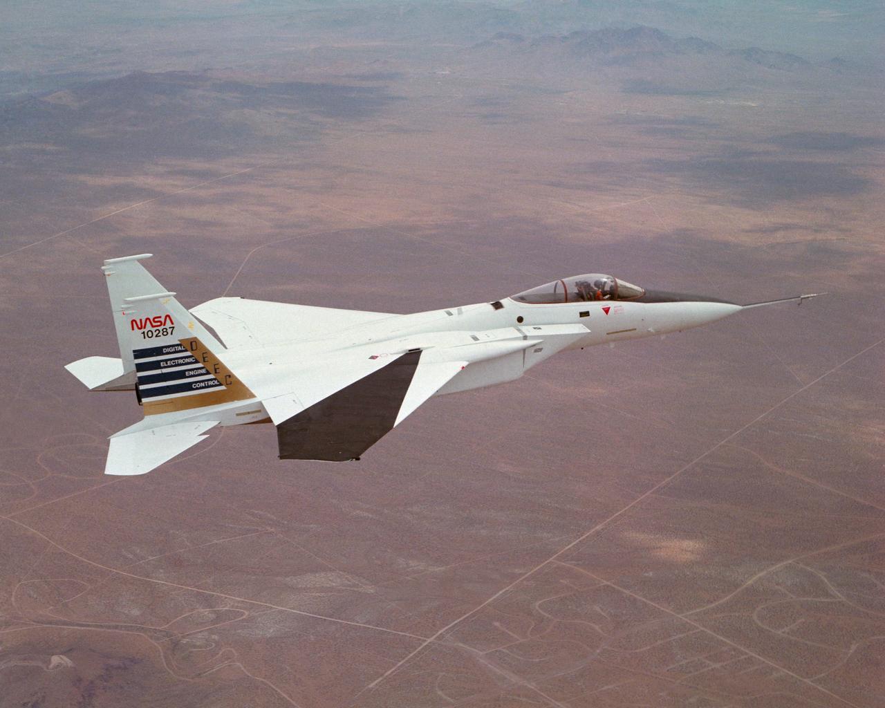 Digital Electronic Engine Control F-15A #287 in flight over California City. Note wing deflection measurement system on right wing. 