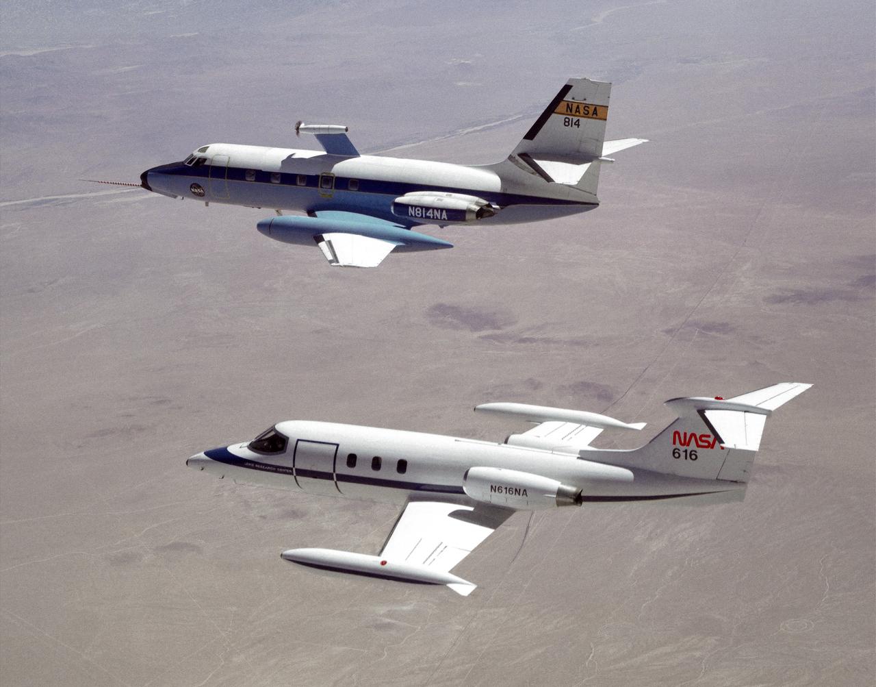 The NASA C-140 JetStar research aircraft (top) is followed by a NASA Learjet equipped with acoustic sensors during one of several tests of advanced propellors mounted on the vertical pylon atop the JetStar's fuselage. Several advanced prop designs were tested on the JetStar in 1982 by NASA's Dryden Flight Research Facility (DFRF), Edwards, California, to study the effects of noise created by propellors on aircraft structures and cabin interiors. To assess possible noise problems with the subscale turbofan, DFRF technicians mounted microphones on both the JetStar and the Learjet chase plane. DFRF then made measurements at close range and at longer distances. The data enabled structural changes and flightpath modifications.