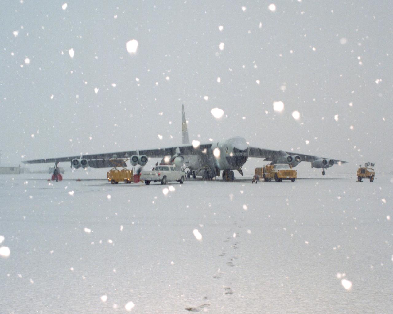 Space Shuttle Solid Rocket Booster Drop Test Vehicle (SRB-DTV) mated to NB-52B in snow