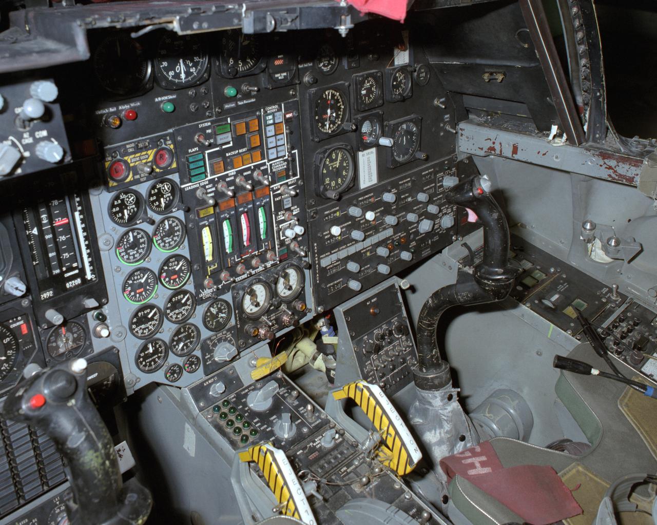 View of the right cockpit of the F-111 MAW aircraft. Unlike most fighter aircraft of the time, the F-111 had side-by-side seating. The pilot sat on the left side, and the weapons systems officer on the right. Both had control sticks to fly the aircraft.