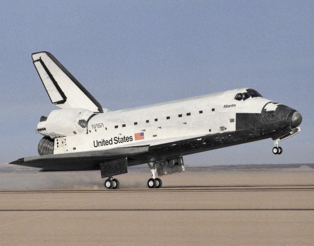 The Space Shuttle Atlantis touches down at 3:35 p.m. PST on 6 December 1988 at NASA's then Ames-Dryden Flight Research Facility at the conclusion of the STS-27 Department of Defense mission. Landing took place on runway 17 of the Rogers Dry Lake, concluding the 4-day, 9-hour, 6-minute mission. The five-man crew was led by Commander Robert L. Gibson and included Pilot Guy S. Gardner; Mission Specialists Jerry L. Ross, William M. Sheperd, and Richard M. Mullane. Atlantis was launched on December 2 from NASA's Kennedy Space Center.