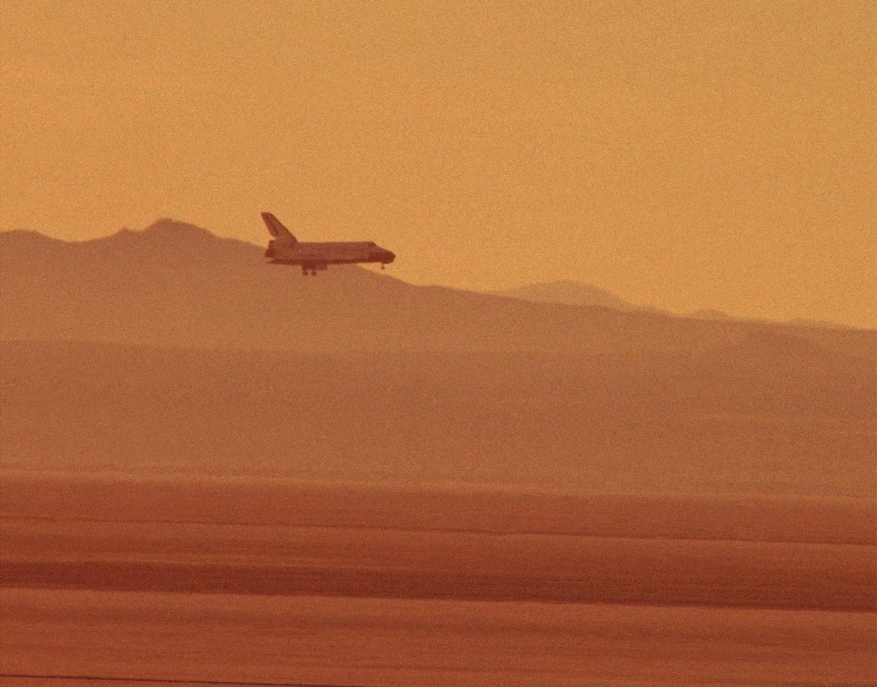 The STS-29 Space Shuttle Discovery mission approaches for a landing at NASA's then Ames-Dryden Flight Research Facility, Edwards AFB, California, early Saturday morning, 18 March 1989. Touchdown was at 6:35:49 a.m. PST and wheel stop was at 6:36:40 a.m. on runway 22. Controllers chose the concrete runway for the landing in order to make tests of braking and nosewheel steering. The STS-29 mission was very successful, completing the launch a Tracking and Data Relay communications satellite, as well as a range of scientific experiments. Discovery's five man crew was led by Commander Michael L. Coats, and included pilot John E. Blaha and mission specialists James P. Bagian, Robert C. Springer, and James F. Buchli.