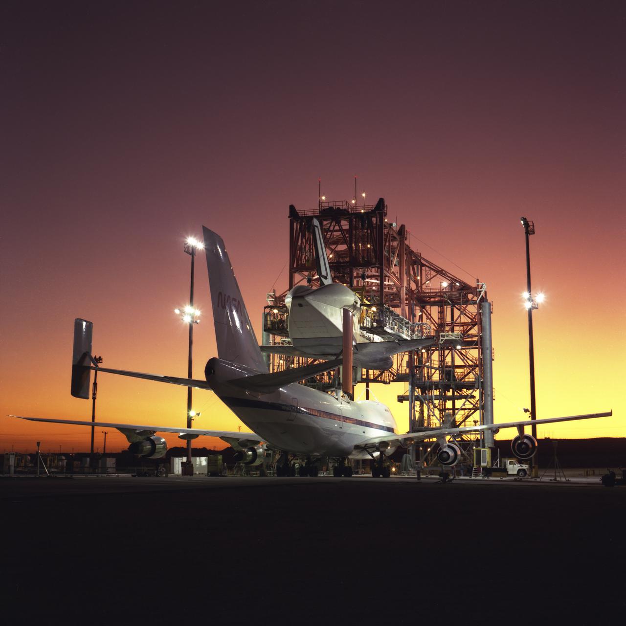 Shuttle Atlantis emerges from the Mate-Demate-Device mounted to Boeing 747 Shuttle Carrier Aircraft for the return flight to Kennedy Space Center in Florida. 