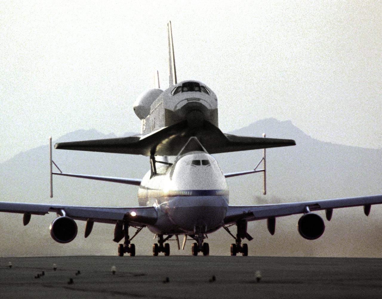NASA's 747 Shuttle Carrier Aircraft No. 911, with the space shuttle orbiter Endeavour securely mounted atop its fuselage, taxies to the runway to begin the ferry flight from Rockwell's Plant 42 at Palmdale, California, where the orbiter was built, to the Kennedy Space Center, Florida. At Kennedy, the space vehicle was processed and launched on orbital mission STS-49, which landed at NASA's Ames-Dryden Flight Research Facility (later redesignated Dryden Flight Research Center), Edwards, California, 16 May 1992. NASA 911, the second modified 747 that went into service in November 1990, has special support struts atop the fuselage and internal strengthening to accommodate the added weight of the orbiters.