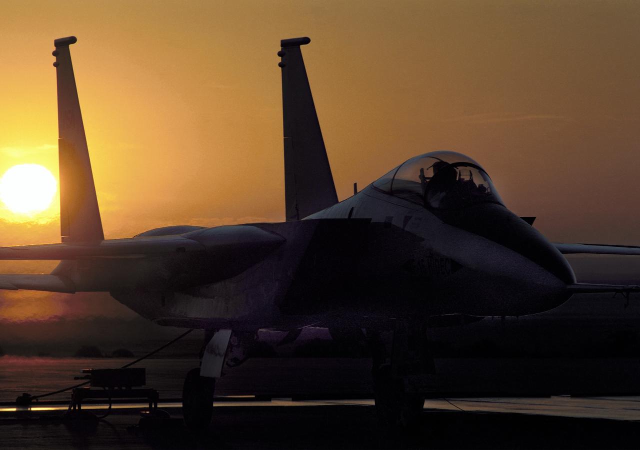 NASA's highly modified F-15A (Serial #71-0287) used for digital electronic flight and engine control systems research, at sunrise on the ramp at the Dryden Flight Research Facility, Edwards, California. The F-15 was called the HIDEC (Highly Integrated Digital Electronic Control) flight facility. Research programs flown on the testbed vehicle have demonstrated improved rates of climb, fuel savings, and engine thrust by optimizing systems performance. The aircraft also tested and evaluated a computerized self-repairing flight control system for the Air Force that detects damaged or failed flight control surfaces. The system then reconfigures undamaged control surfaces so the mission can continue or the aircraft is landed safely.