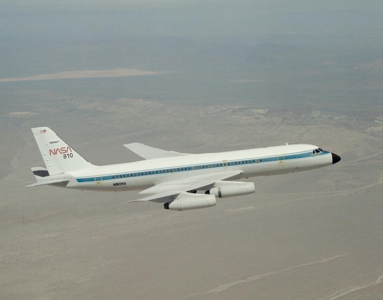 A NASA CV-990, modified as a Landing Systems Research Aircraft (LSRA), in flight over NASA's Dryden Flight Research Center, Edwards, California, for a test of the space shuttle landing gear system. The space shuttle landing gear test unit, operated by a high-pressure hydraulic system, allowed engineers to assess and document the performance of space shuttle main and nose landing gear systems, tires and wheel assemblies, plus braking and nose wheel steering performance. The series of 155 test missions for the space shuttle program provided extensive data about the life and endurance of the shuttle tire systems and helped raise the shuttle crosswind landing limits at Kennedy.