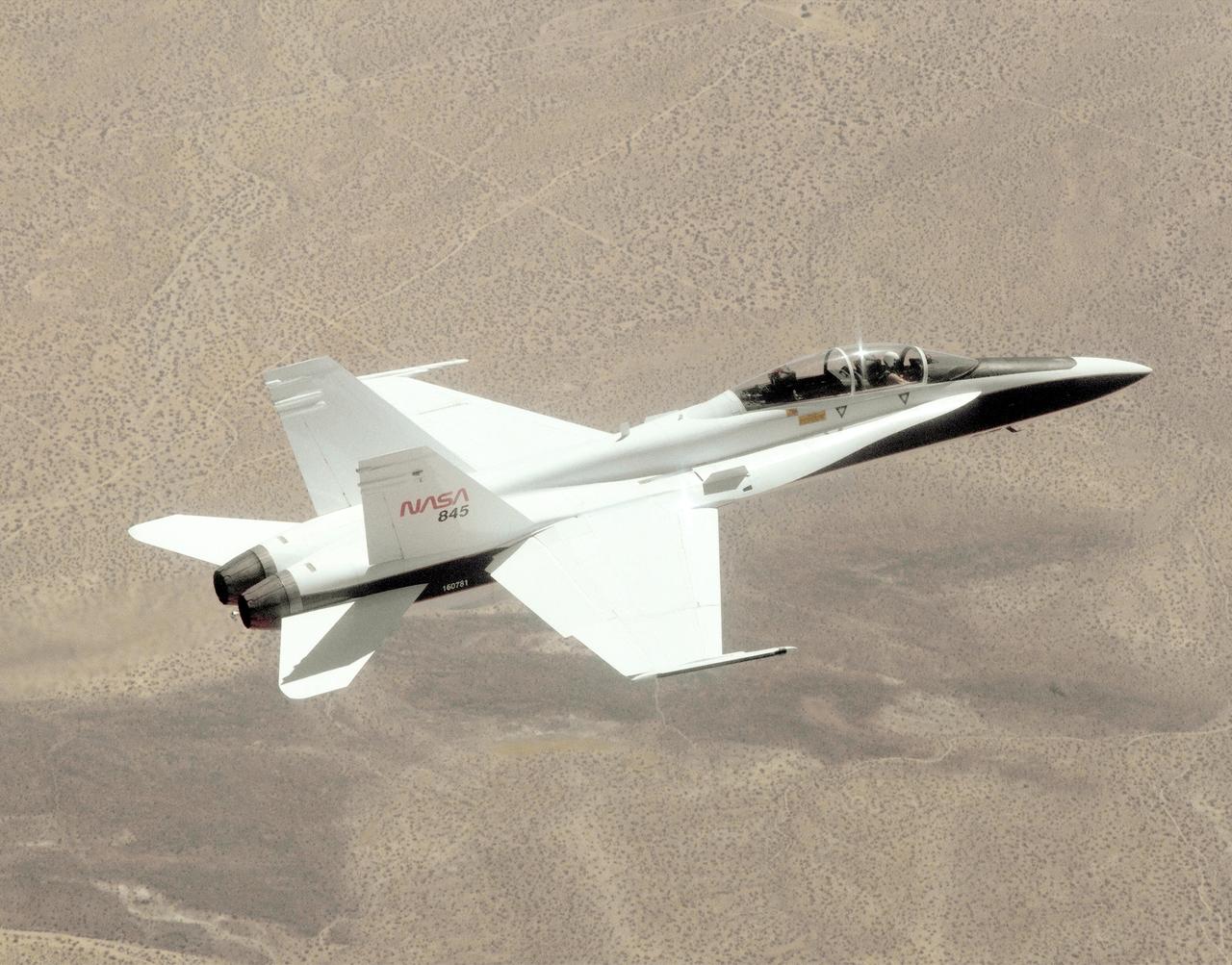 A NASA F/A-18, specially modified to test the newest and most advanced system technologies, on its first research flight on May 21, 1993, at NASA's Dryden Flight Research Facility, Edwards, California. Flown by Dryden in a multi-year, joint NASA/DOD/industry program, the F/A-18 former Navy fighter was modified into a unique Systems Research Aircraft (SRA) to investigate a host of new technologies in the areas of flight controls, airdata sensing and advanced computing. The primary goal of the SRA program was to validate through flight research cutting-edge technologies which could benefit future aircraft and spacecraft by improving efficiency and performance, reducing weight and complexity, with a resultant reduction on development and operational costs.