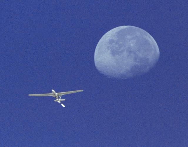 NASA image: Perseus A in Flight with Moon