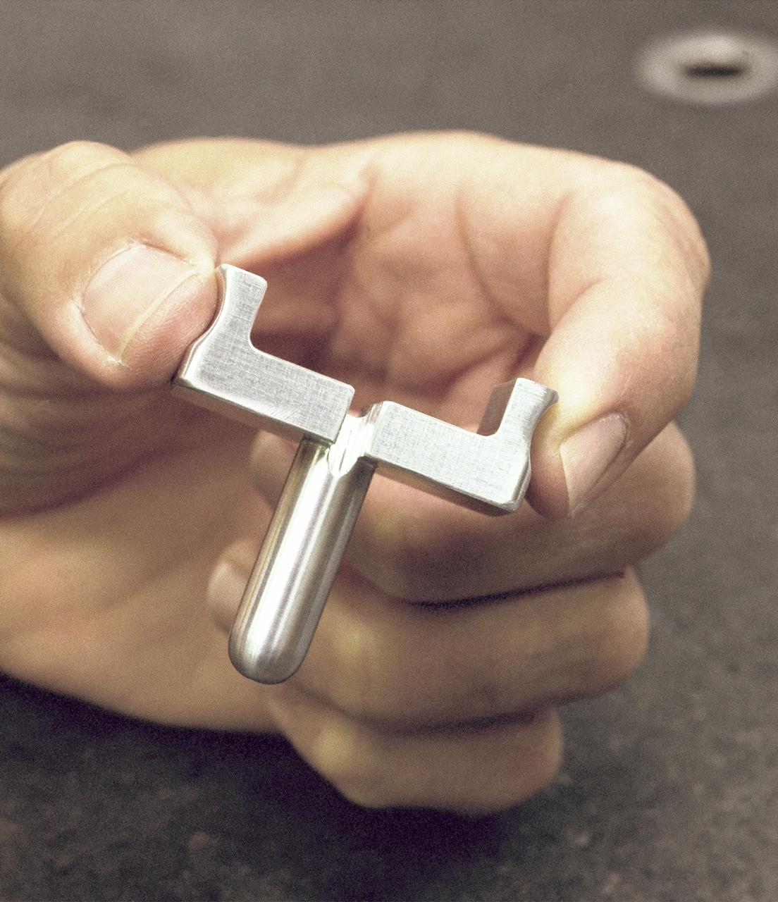 Dryden-built surgical suture instrument